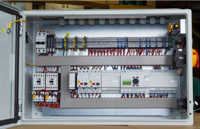 Completed electrical control panel with neatly arranged components and wiring